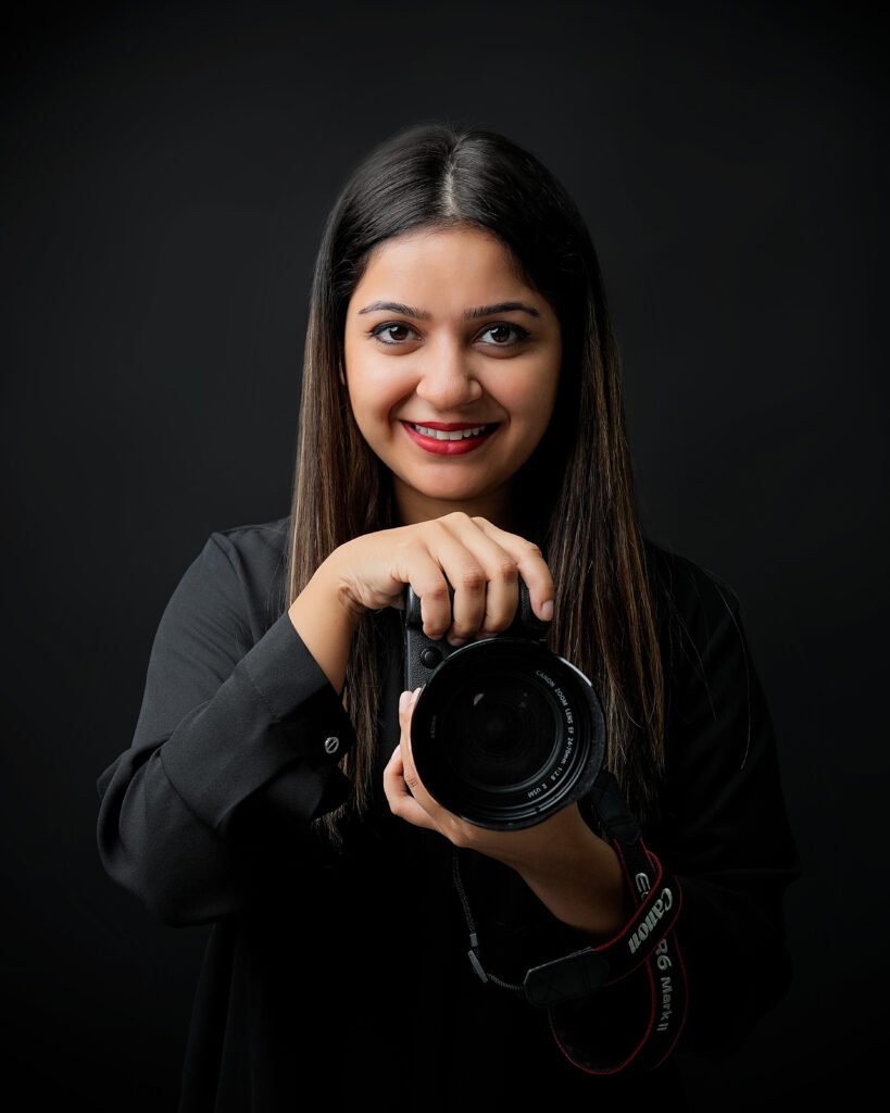 a woman holding a camera